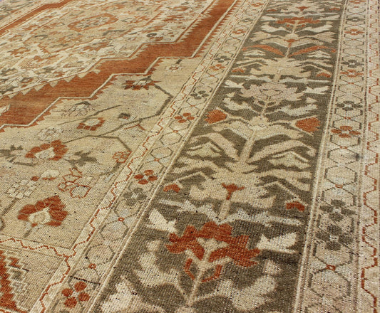 Vintage Turkish Oushak Rug This beautiful Turkish Oushak rug, handwoven in Turkey, beautifully integrates neutral compositions. This rug features an exquisite geometric design with a large central medallion. The green, wide border surrounds the ... - Keivan Woven ArtsEN - 123477 - 3810Rug