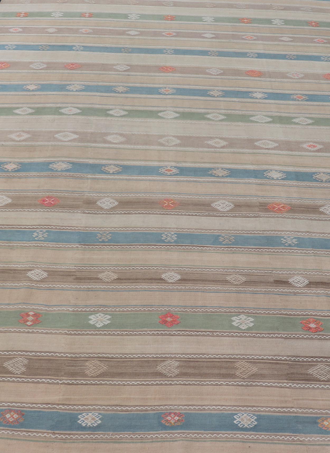 Vintage Hand - Woven Flatweave Kilim in Wool with Sub - Geometric Design and Motifs This flat - weave tribal kilim has been hand - woven in wool. The rug features a horizontal stripe design, accentuated by various sub - geometric motifs. The rug has been... - Keivan Woven ArtsEN - 13103 - 15725