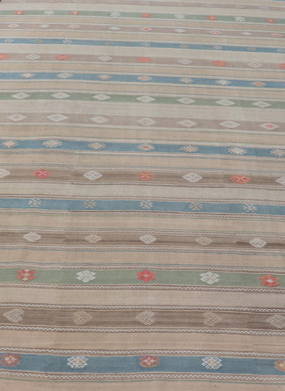 Vintage Hand - Woven Flatweave Kilim in Wool with Sub - Geometric Design and Motifs This flat - weave tribal kilim has been hand - woven in wool. The rug features a horizontal stripe design, accentuated by various sub - geometric motifs. The rug has been... - Keivan Woven ArtsEN - 13103 - 15725