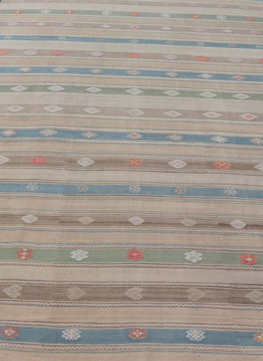 Vintage Hand - Woven Flatweave Kilim in Wool with Sub - Geometric Design and Motifs This flat - weave tribal kilim has been hand - woven in wool. The rug features a horizontal stripe design, accentuated by various sub - geometric motifs. The rug has been... - Keivan Woven ArtsEN - 13103 - 15725