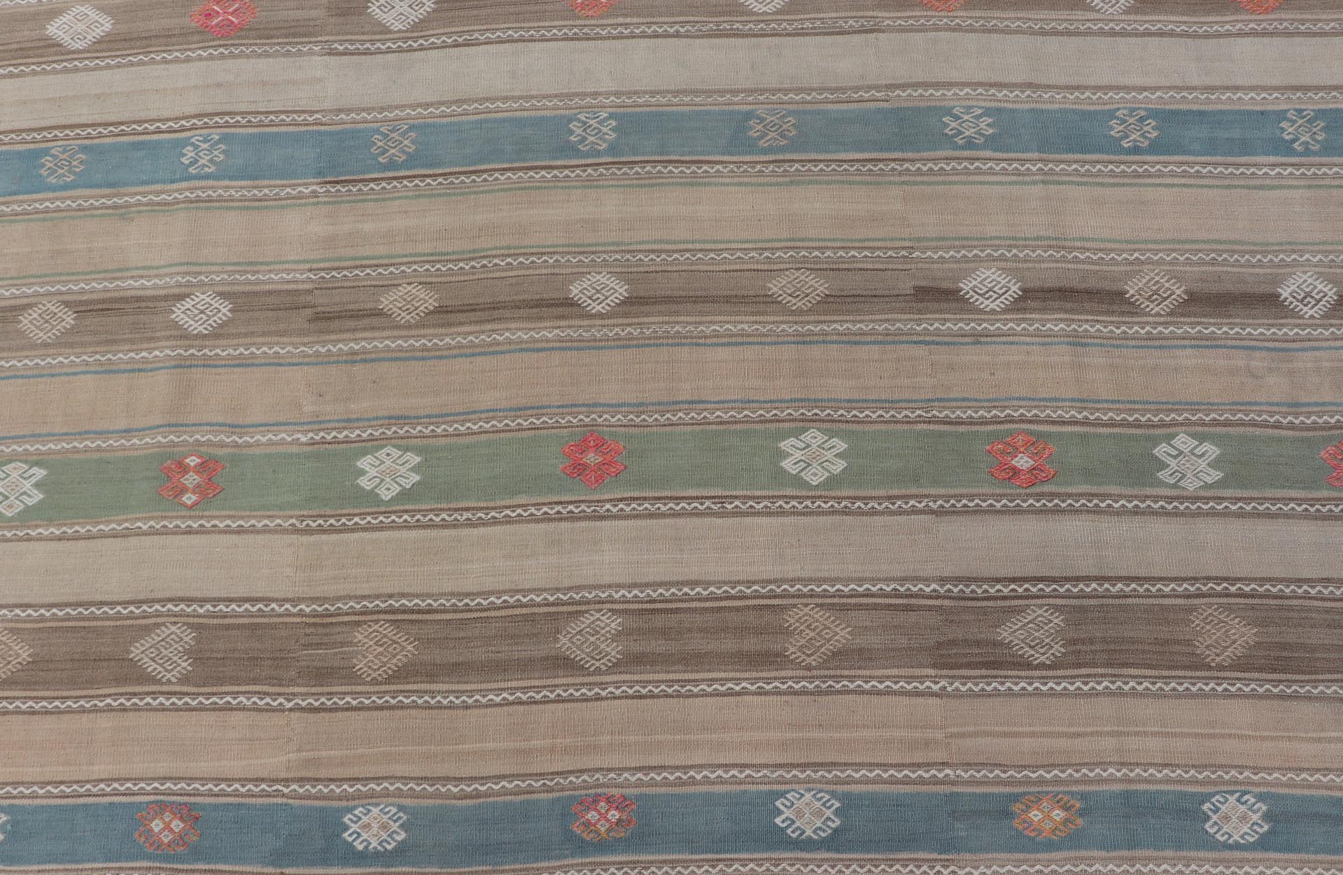 Vintage Hand - Woven Flatweave Kilim in Wool with Sub - Geometric Design and Motifs This flat - weave tribal kilim has been hand - woven in wool. The rug features a horizontal stripe design, accentuated by various sub - geometric motifs. The rug has been... - Keivan Woven ArtsEN - 13103 - 15725
