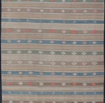 Vintage Hand - Woven Flatweave Kilim in Wool with Sub - Geometric Design and Motifs This flat - weave tribal kilim has been hand - woven in wool. The rug features a horizontal stripe design, accentuated by various sub - geometric motifs. The rug has been... - Keivan Woven ArtsEN - 13103 - 15725
