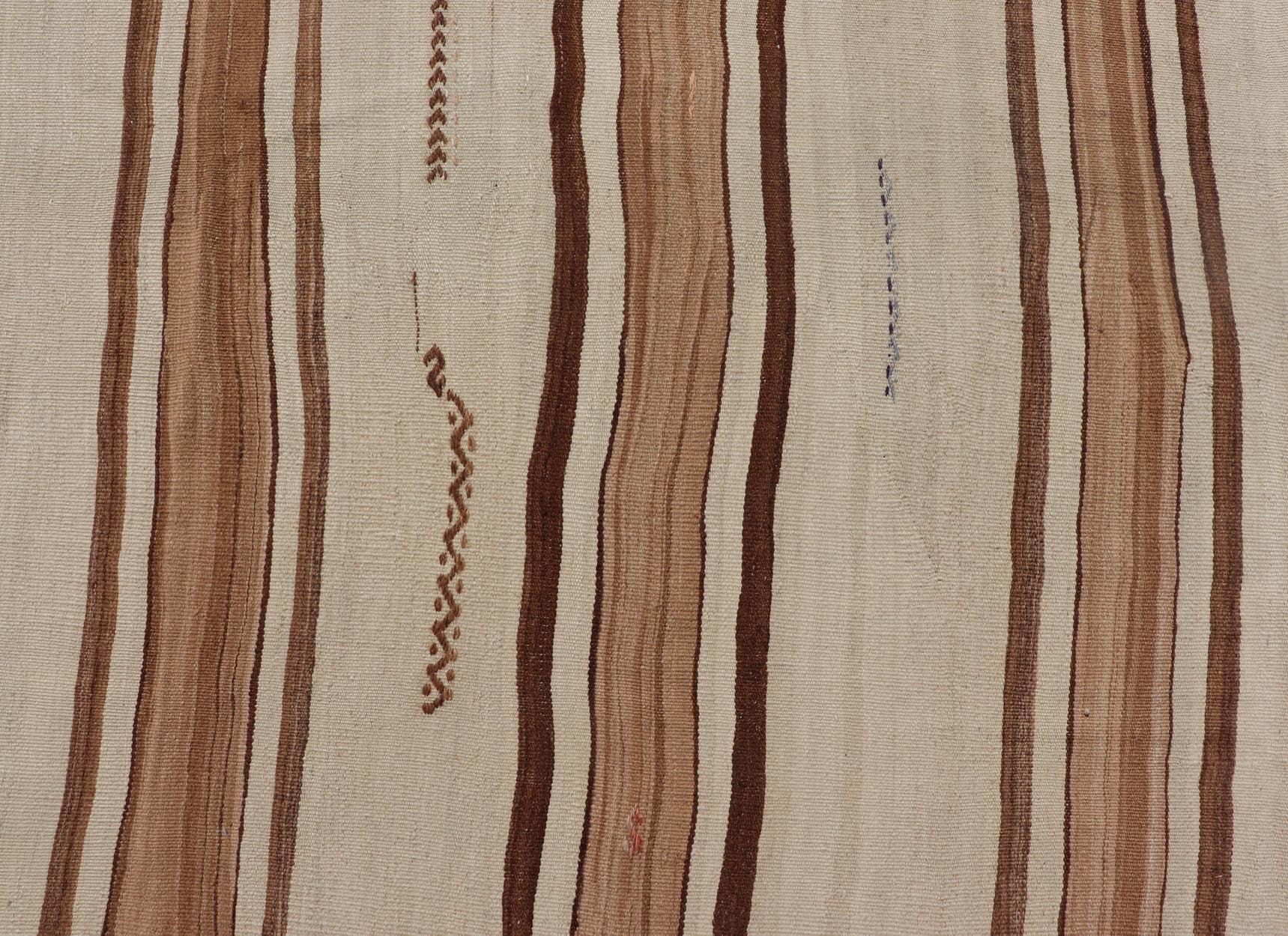 Large Vintage Flat - Woven Turkish Paneled Kilim Rug in Wool with Stripe Design This flat - weave tribal Turkish kilim has been hand - woven in wool. The rug features an sub - geometric striped design, and is rendered earthy tones; making this rug a su... - Keivan Woven ArtsEN - 13113 - 178719 - 178838 - 19748