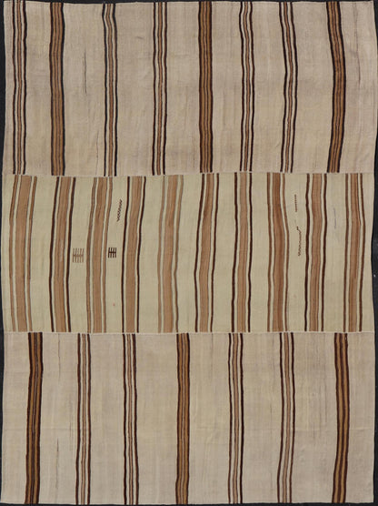 Large Vintage Flat - Woven Turkish Paneled Kilim Rug in Wool with Stripe Design This flat - weave tribal Turkish kilim has been hand - woven in wool. The rug features an sub - geometric striped design, and is rendered earthy tones; making this rug a su... - Keivan Woven ArtsEN - 13113 - 178719 - 178838 - 19748
