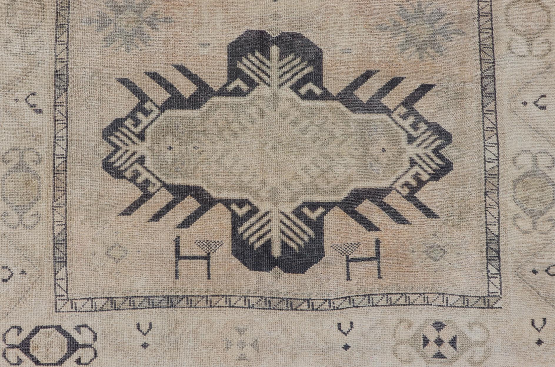 Vintage Oushak Rug from Turkey with Navy Blue and Floral Medallion's. Keivan Woven Arts / rug/EN - 13264, country of origin / type: Turkey / Oushak, circa 1950. Measures: 4'7 x 7'0 This vintage Turkish Oushak rug features a faint, etched medallion... - Keivan Woven ArtsEN - 13264 - 23096Rug