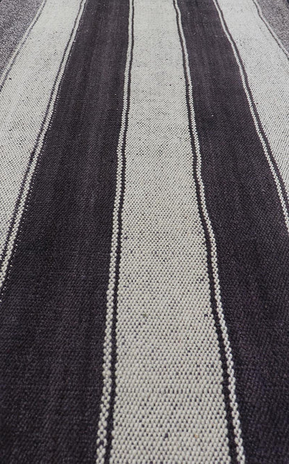 Vintage Turkish Kilim with Vertical Stripes in Brown and Cream Measures 2'7 x 6'2 This vintage flat weave Kilim has a very modern stripe design. Rendered in ebony, cream. With neutral colors and simple design, this flat weave is perfect ... - Keivan Woven ArtsEN - 13425 - 18655Rug