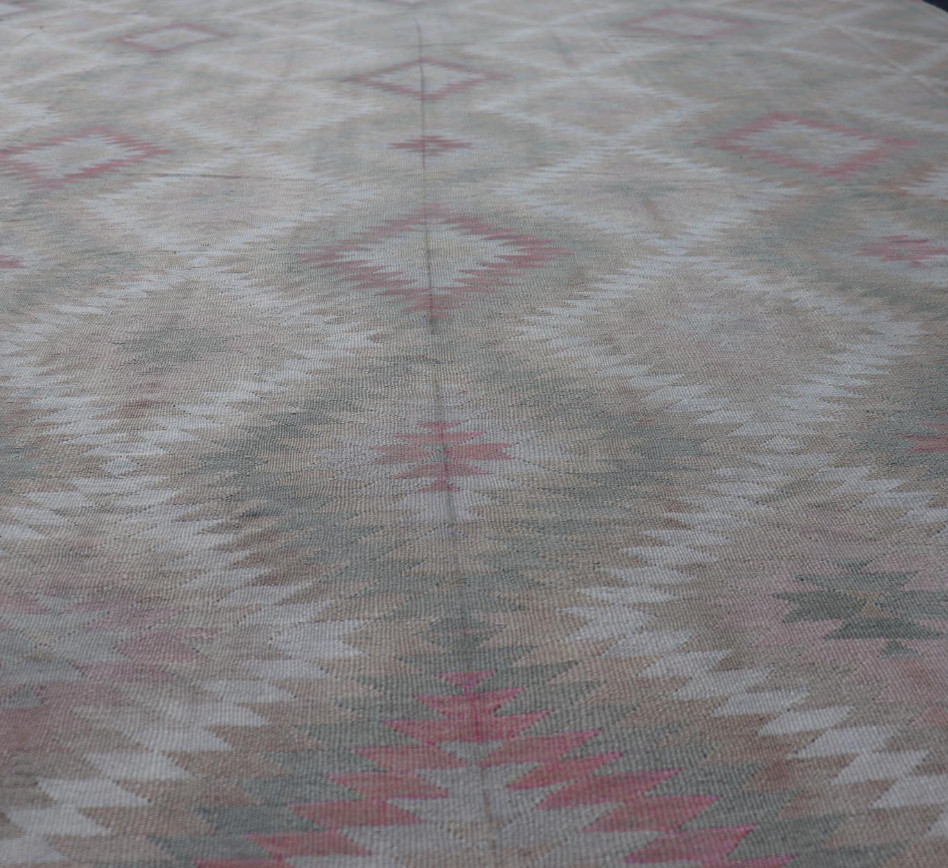 Measures: 8'0 x 11'0 Vintage Turkish Flat Weave Rug with Geometric Diamond Design in Green and Pink. Keivan Woven Arts / rug EN - 13440, country of origin / type: Turkey / Kilim, circa 1950. This geometric Kilim from Turkey bears a repeating l... - Keivan Woven ArtsEN - 13440 - 21621Rug