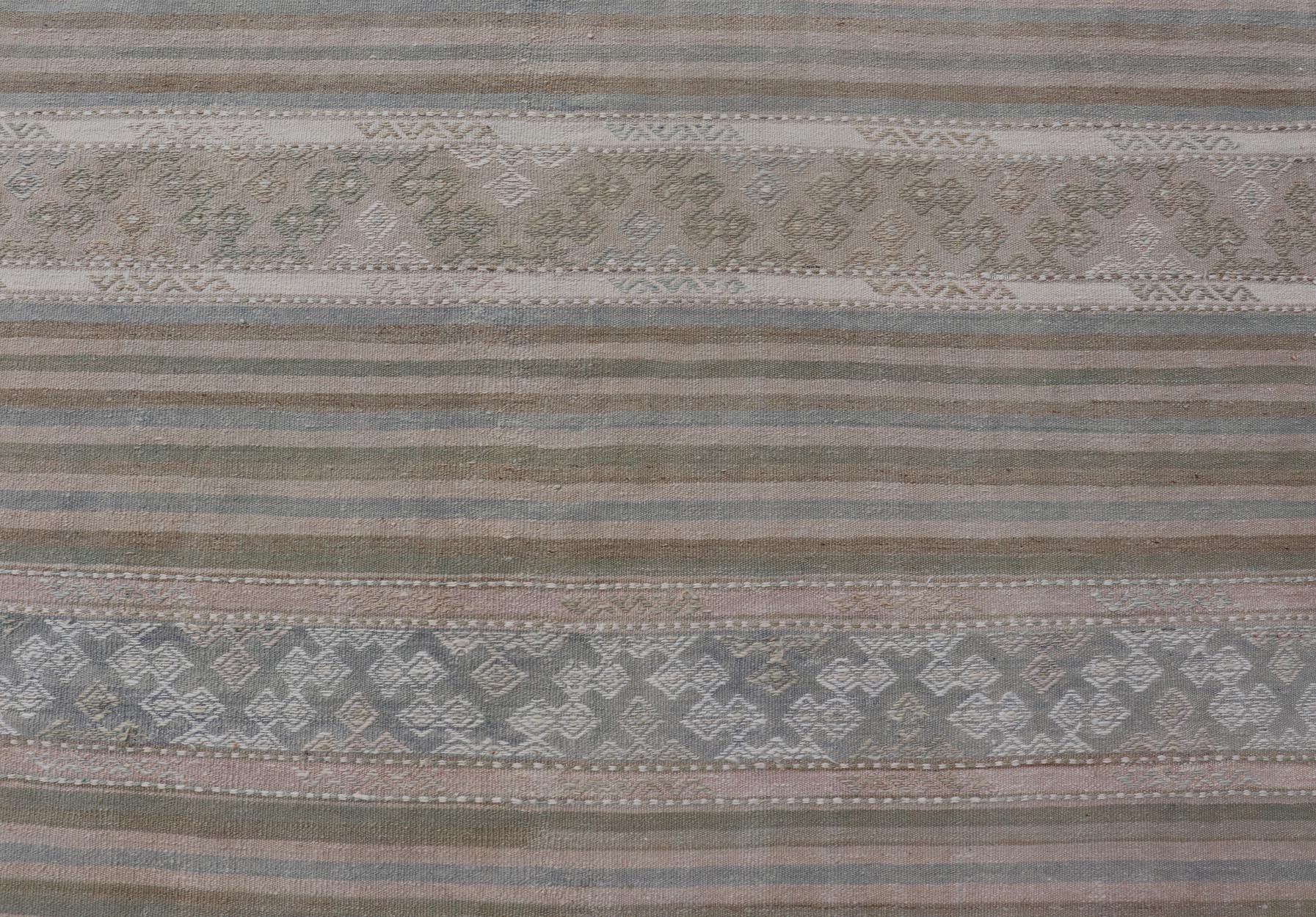 Turkish Gallery Flat - Weave Kilim in Muted Colors with Stripes and Embroideries Measures: 5'2 x 10'1 This charming vintage flat weave Kilim was hand woven in Turkey during the 1950s. Varying color combinations of muted shades of blue,... - Keivan Woven ArtsEN - 13481 - 19250Rug
