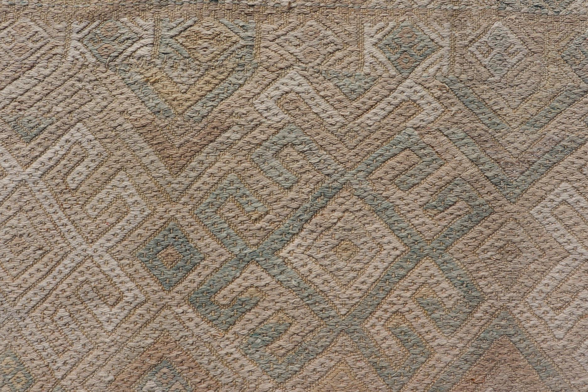 Vintage Turkish Embroidered Rug with All - Over Geometric Diamond Design Measures: 5'0 x 6'5 This vintage Turkish Kilim features soft neutral colors and a woven texture. The design is a sub - geometric tribal diamond design in faded light gr... - Keivan Woven ArtsEN - 13483 - 18818Rug