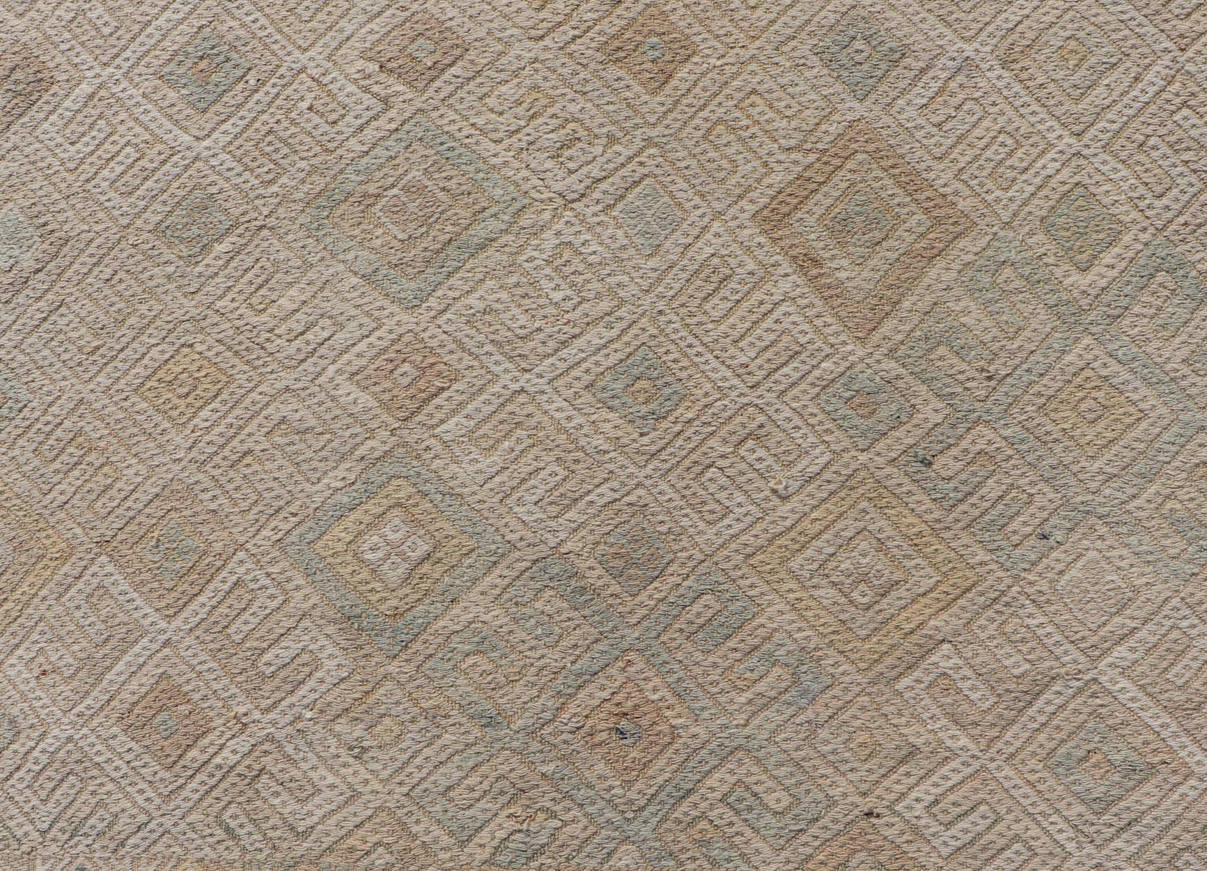 Vintage Turkish Embroidered Rug with All - Over Geometric Diamond Design Measures: 5'0 x 6'5 This vintage Turkish Kilim features soft neutral colors and a woven texture. The design is a sub - geometric tribal diamond design in faded light gr... - Keivan Woven ArtsEN - 13483 - 18818Rug