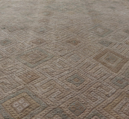 Vintage Turkish Embroidered Rug with All - Over Geometric Diamond Design Measures: 5'0 x 6'5 This vintage Turkish Kilim features soft neutral colors and a woven texture. The design is a sub - geometric tribal diamond design in faded light gr... - Keivan Woven ArtsEN - 13483 - 18818Rug
