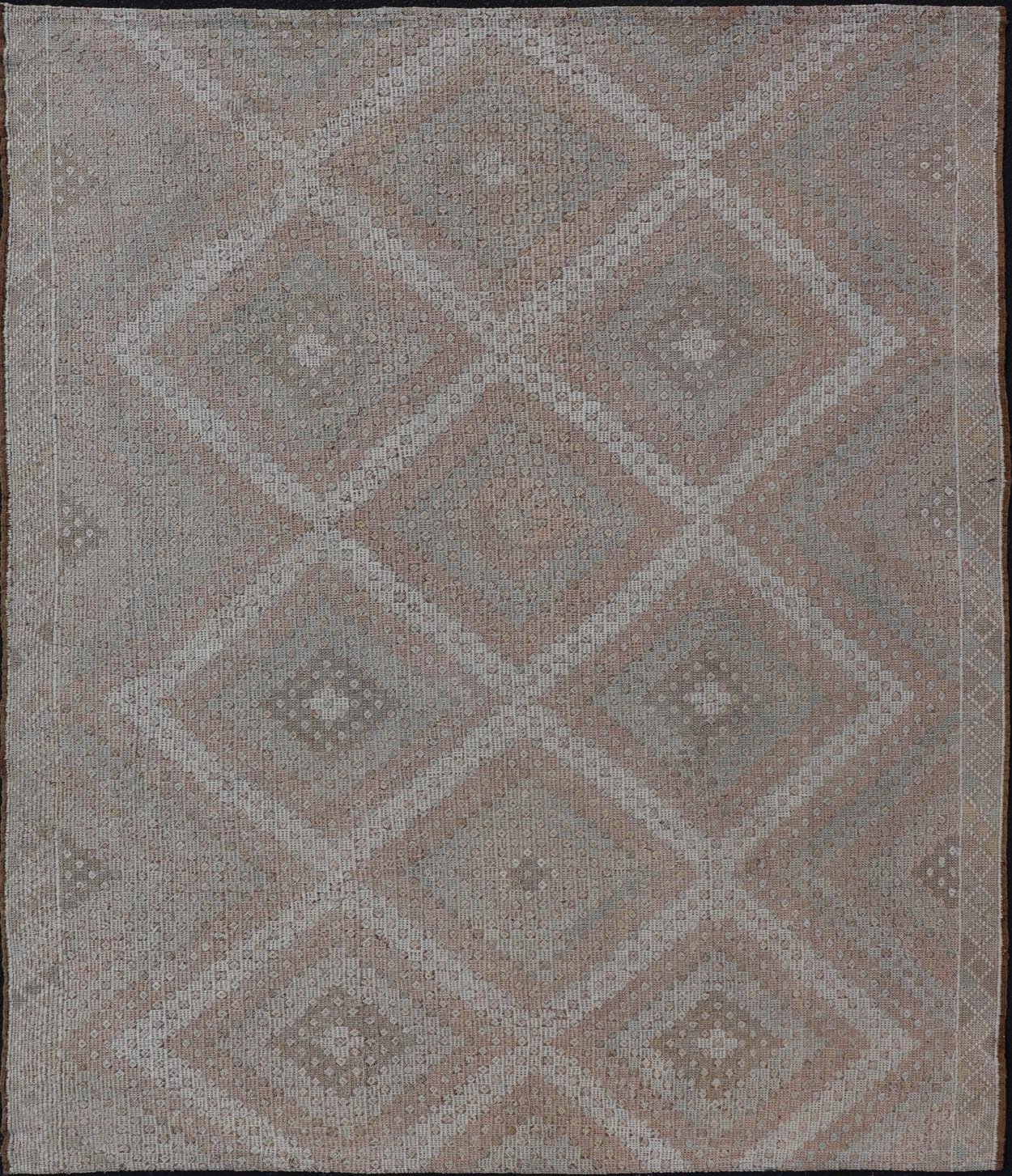 Vintage Turkish Embroidered Rug with Geometric Diamond Design with Soft Colors Embroidered vintage rug from Turkey in shades of tan, light green, light red, and cream with geometric pattern, Keivan Woven Arts / rug EN - 13652, country of origin / ... - Keivan Woven ArtsEN - 13652 - 18830Rug