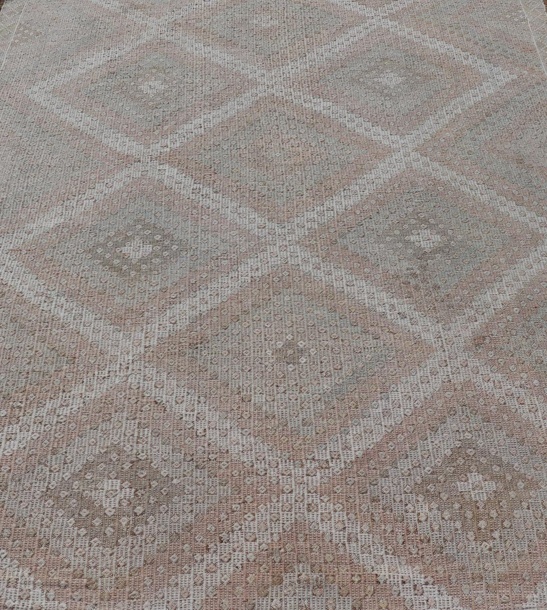 Vintage Turkish Embroidered Rug with Geometric Diamond Design with Soft Colors Embroidered vintage rug from Turkey in shades of tan, light green, light red, and cream with geometric pattern, Keivan Woven Arts / rug EN - 13652, country of origin / ... - Keivan Woven ArtsEN - 13652 - 18830Rug