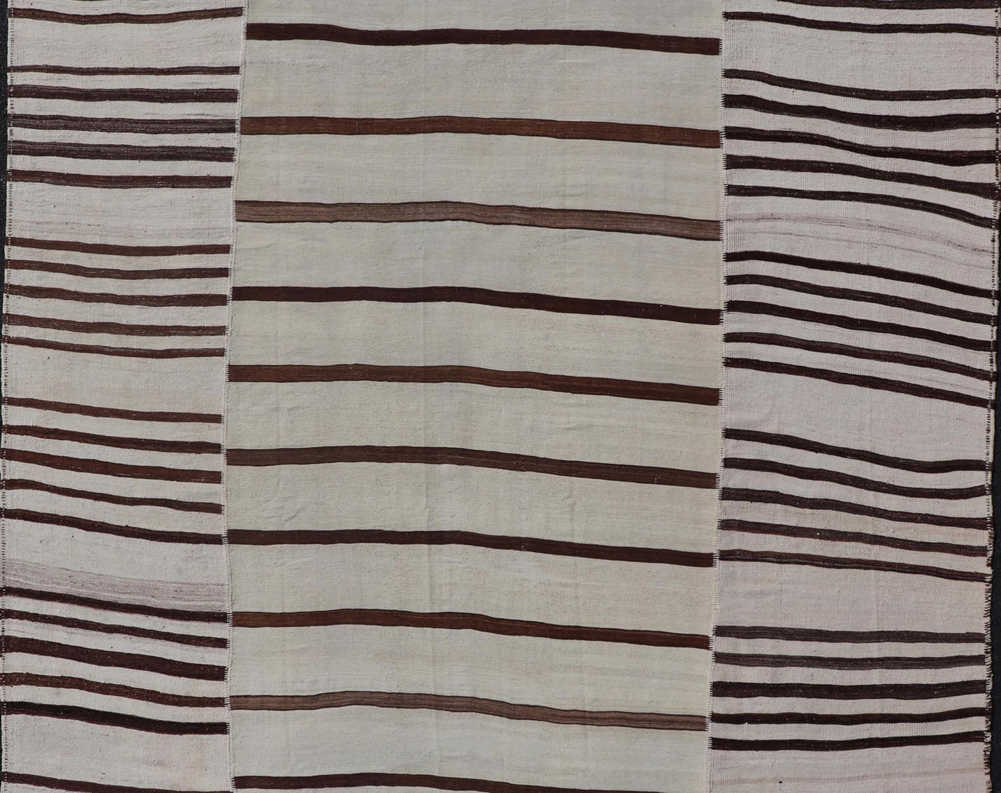 Vintage Hand - Woven Turkish Kilim in Wool with Sub - Geometric Striped Panel Design This flat - weave tribal Turkish kilim has been hand - woven in wool. The rug features an all - over sub - geometric striped panel design, rendered in earthy tones; making... - Keivan Woven ArtsEN - 13689 - 13213 - 19490