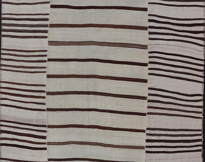 Vintage Hand - Woven Turkish Kilim in Wool with Sub - Geometric Striped Panel Design This flat - weave tribal Turkish kilim has been hand - woven in wool. The rug features an all - over sub - geometric striped panel design, rendered in earthy tones; making... - Keivan Woven ArtsEN - 13689 - 13213 - 19490