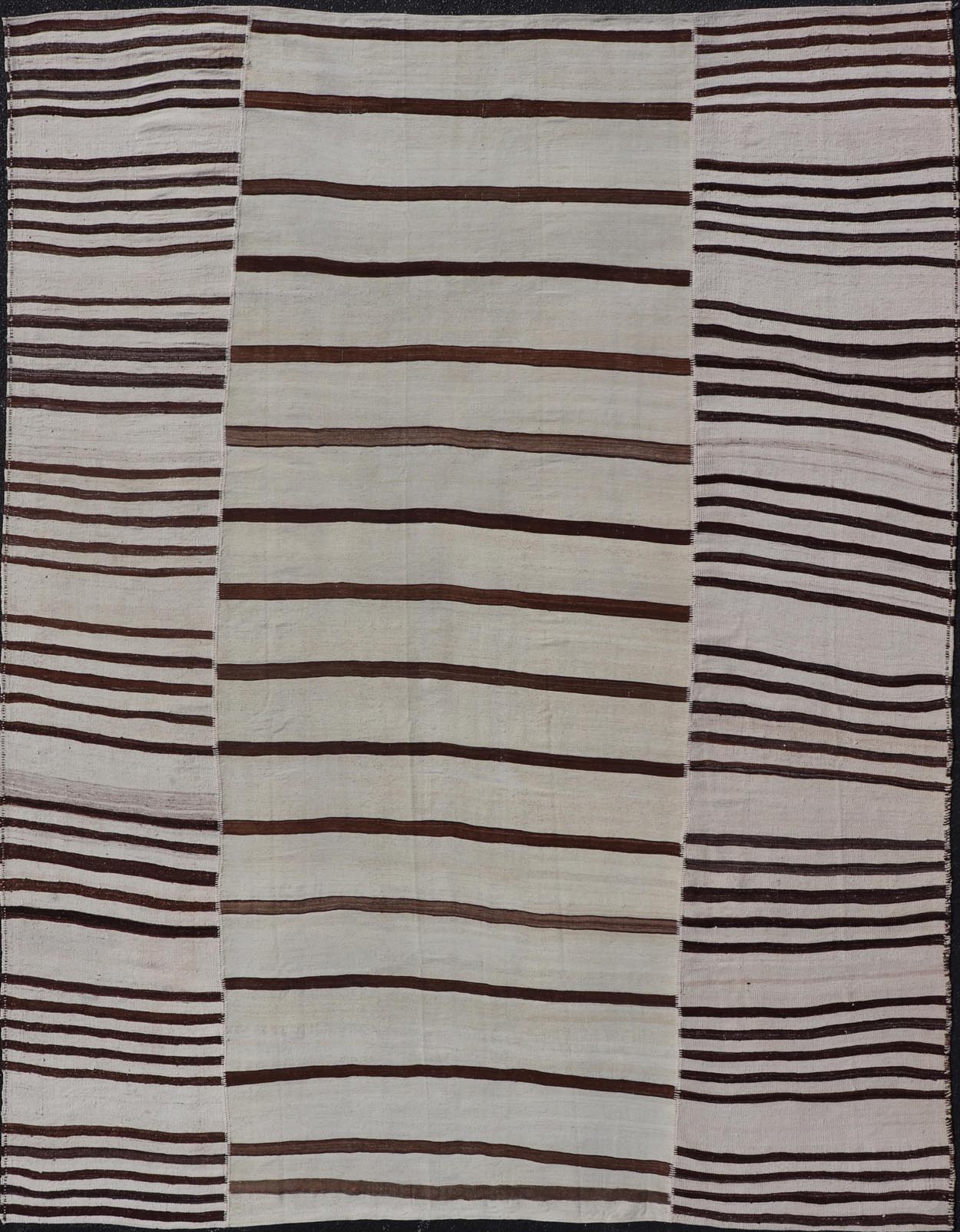 Vintage Hand - Woven Turkish Kilim in Wool with Sub - Geometric Striped Panel Design This flat - weave tribal Turkish kilim has been hand - woven in wool. The rug features an all - over sub - geometric striped panel design, rendered in earthy tones; making... - Keivan Woven ArtsEN - 13689 - 13213 - 19490