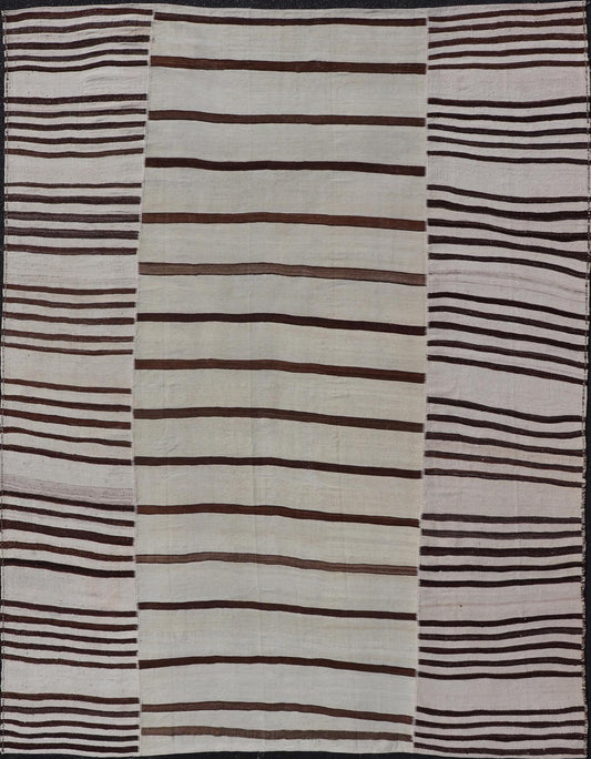 Vintage Hand - Woven Turkish Kilim in Wool with Sub - Geometric Striped Panel Design This flat - weave tribal Turkish kilim has been hand - woven in wool. The rug features an all - over sub - geometric striped panel design, rendered in earthy tones; making... - Keivan Woven ArtsEN - 13689 - 13213 - 19490
