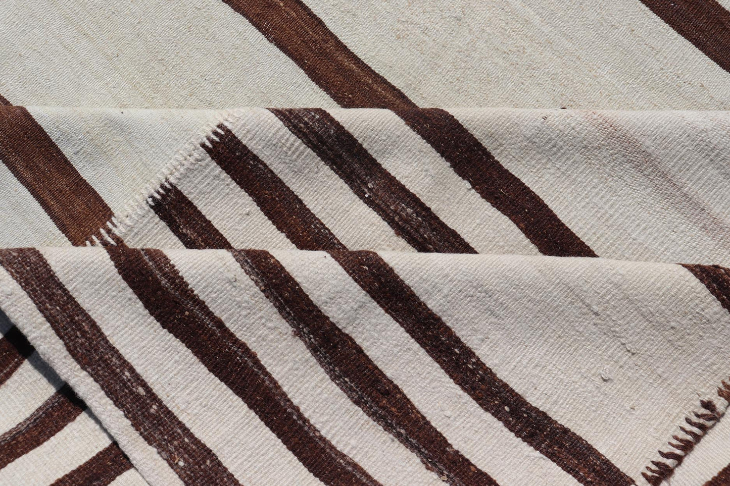 Vintage Hand - Woven Turkish Kilim in Wool with Sub - Geometric Striped Panel Design This flat - weave tribal Turkish kilim has been hand - woven in wool. The rug features an all - over sub - geometric striped panel design, rendered in earthy tones; making... - Keivan Woven ArtsEN - 13689 - 13213 - 19490