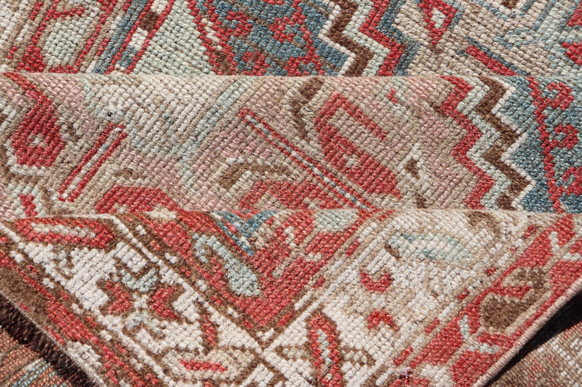 Antique Hand - Knotted Persian Kurdish Rug in Wool with Medallion Design This antique Persian Kurdish rug has been hand - knotted in wool and features a sub - geometric medallion design rendered in multicolor. A complementary, multi - tiered border enc... - Keivan Woven ArtsEN - 13903 - 19652