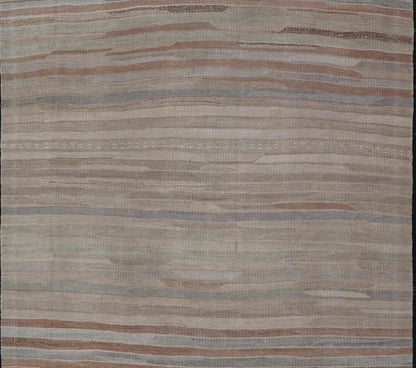 Minimalist Striped Design Vintage Turkish Kilim with Neutral Tones Measures 3'9 x 6'0 This wonderful piece features easy colors and a simple design. The palette consists of muted reds and blues, accenting the camel, fawn, and cocoa mass. ... - Keivan Woven ArtsEN - 13942 - 18926Rug