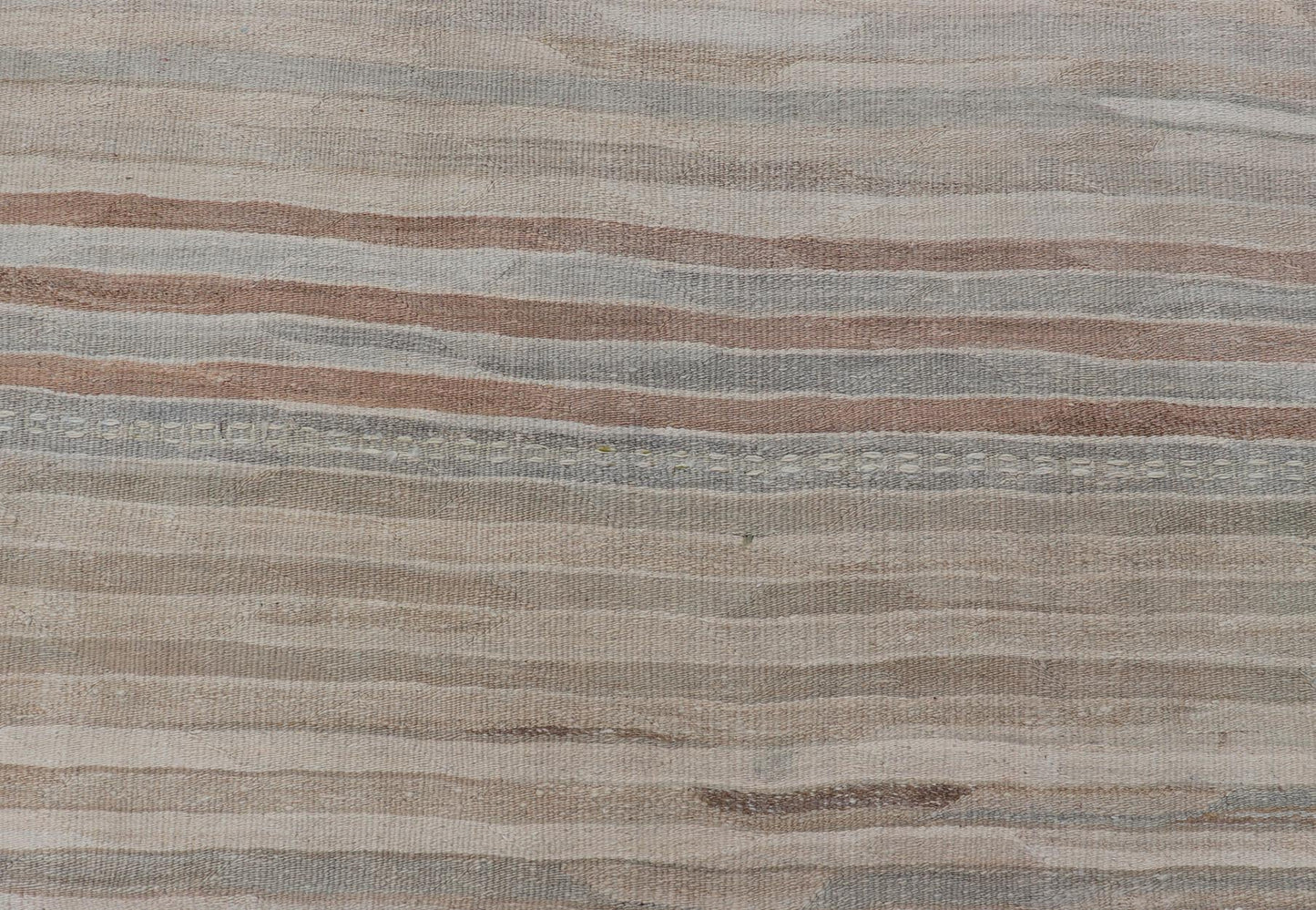 Minimalist Striped Design Vintage Turkish Kilim with Neutral Tones Measures 3'9 x 6'0 This wonderful piece features easy colors and a simple design. The palette consists of muted reds and blues, accenting the camel, fawn, and cocoa mass. ... - Keivan Woven ArtsEN - 13942 - 18926Rug