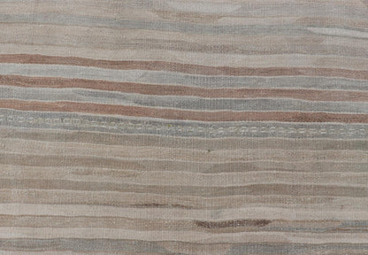 Minimalist Striped Design Vintage Turkish Kilim with Neutral Tones Measures 3'9 x 6'0 This wonderful piece features easy colors and a simple design. The palette consists of muted reds and blues, accenting the camel, fawn, and cocoa mass. ... - Keivan Woven ArtsEN - 13942 - 18926Rug