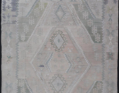 Vintage Hand - Woven Turkish Kilim in Wool with Medallion Sub - Geometric Design This flat - weave tribal Turkish kilim has been hand - woven in wool. The rug features an all - over sub - geometric medallion design, rendered in greens, blues and neutra... - Keivan Woven ArtsEN - 13963 - 19496