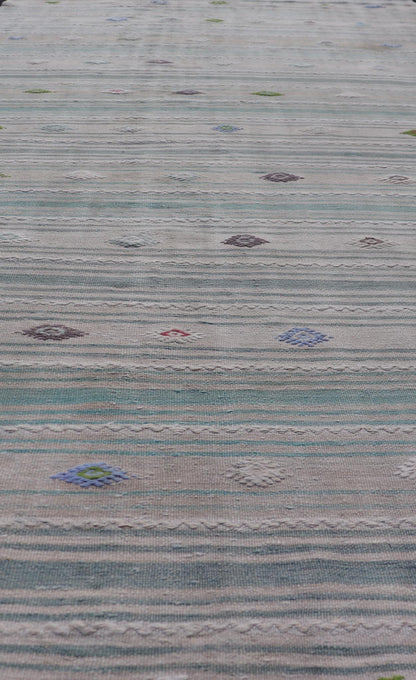 Vintage Hand - Woven Turkish Kilim Gallery Rug in Wool with All - Over Stripe Design This flat - weave tribal Turkish kilim has been hand - woven in wool. The rug features an all - over sub - geometric striped design, and is rendered in multicolor; making ... - Keivan Woven ArtsEN - 13980 - 19502Rug