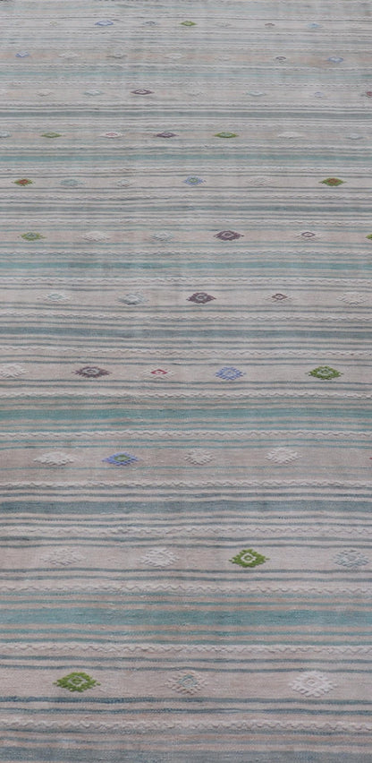 Vintage Hand - Woven Turkish Kilim Gallery Rug in Wool with All - Over Stripe Design This flat - weave tribal Turkish kilim has been hand - woven in wool. The rug features an all - over sub - geometric striped design, and is rendered in multicolor; making ... - Keivan Woven ArtsEN - 13980 - 19502Rug