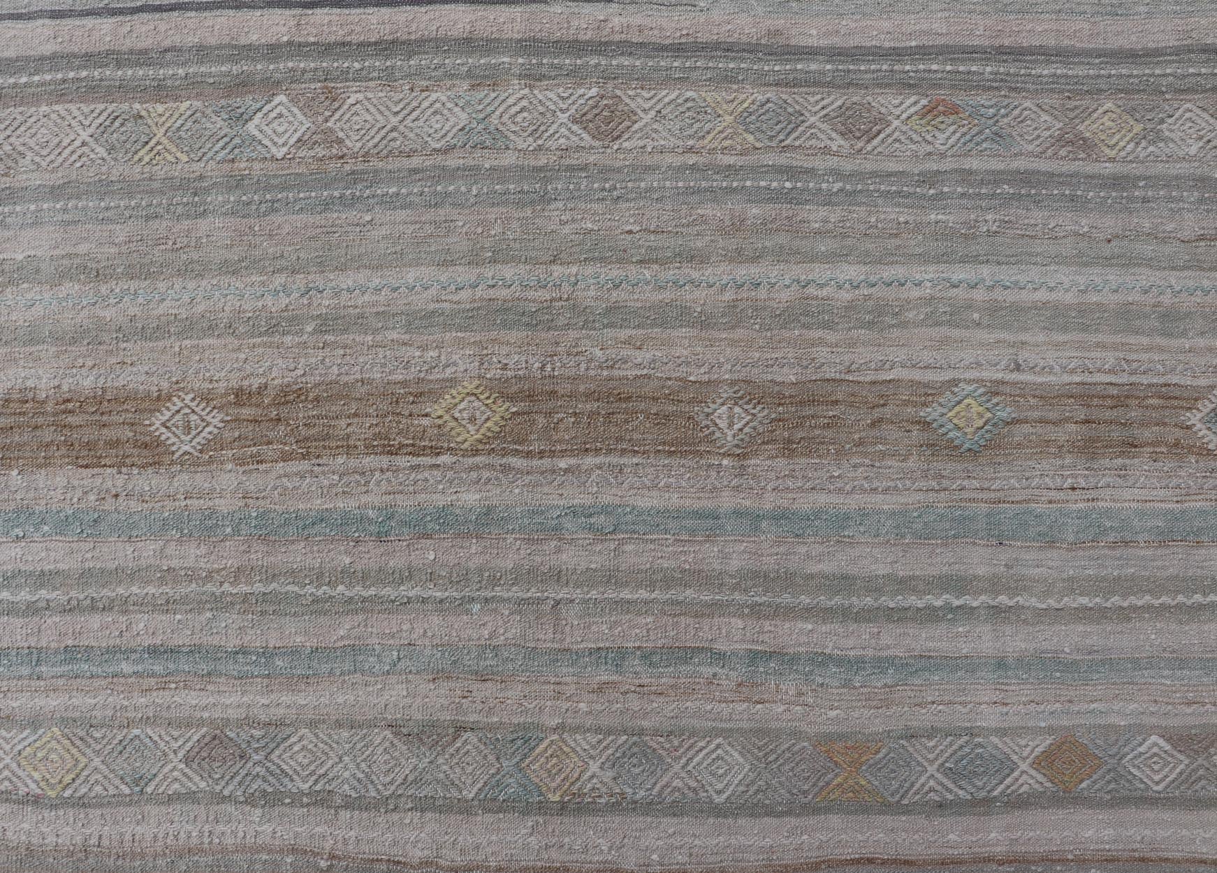Turkish Flat - Weave Kilim with Embroideries in Taupe, Tan, Light Green, and Gray Vintage flat - weave Kilim with embroideries in tan, light green, and gray with a modern design geometric stripe design Vintage Kilim from Turkey, Keivan Woven Arts... - Keivan Woven ArtsEN - 13981 - 18872