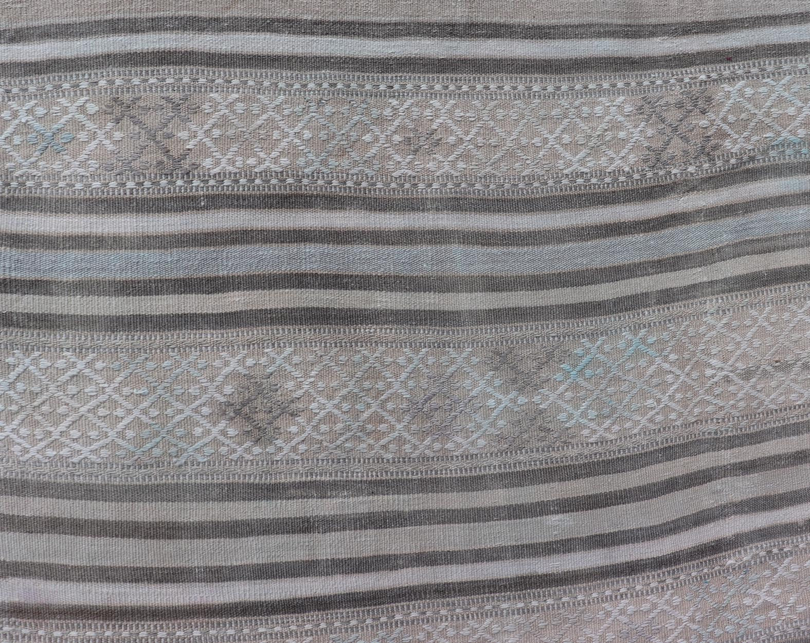 Measures: 5'6 x 8'3 Turkish Flat - Weave Kilim with Embroideries in Taupe, Tan, Cream, and Blue. Keivan Woven Arts / rug EN - 14002, country of origin / type: Turkey / Kilim, circa 1950 This vintage Turkish Kilim rug features a contemporary geom... - Keivan Woven ArtsEN - 14002 - 21757Rug