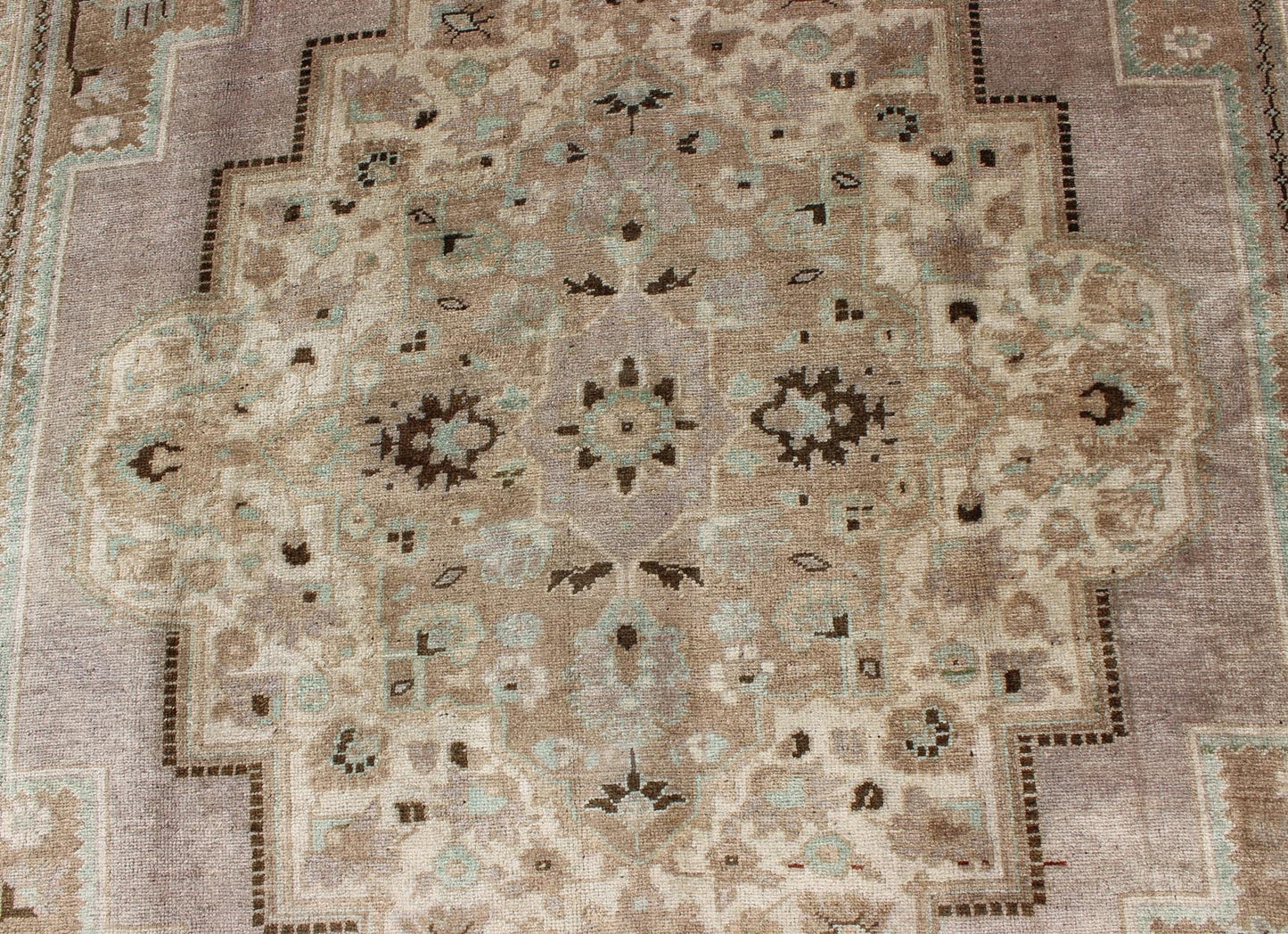 Vintage Turkish Floral Medallion Oushak in Earth Tones, Lavender, and Ice Blue Measures: 7'2 x 11'0 This stunning vintage Turkish Oushak carpet (circa mid - 20th century) features a central medallion with floral motifs and subtle sub - geome... - Keivan Woven ArtsEN - 140042 - 5550Rug