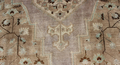 Vintage Turkish Floral Medallion Oushak in Earth Tones, Lavender, and Ice Blue Measures: 7'2 x 11'0 This stunning vintage Turkish Oushak carpet (circa mid - 20th century) features a central medallion with floral motifs and subtle sub - geome... - Keivan Woven ArtsEN - 140042 - 5550Rug
