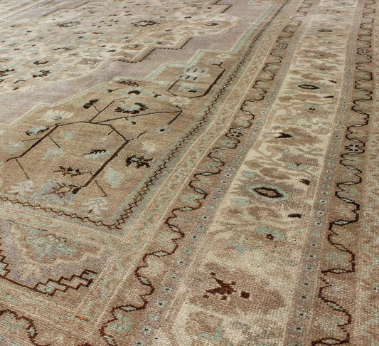 Vintage Turkish Floral Medallion Oushak in Earth Tones, Lavender, and Ice Blue Measures: 7'2 x 11'0 This stunning vintage Turkish Oushak carpet (circa mid - 20th century) features a central medallion with floral motifs and subtle sub - geome... - Keivan Woven ArtsEN - 140042 - 5550Rug