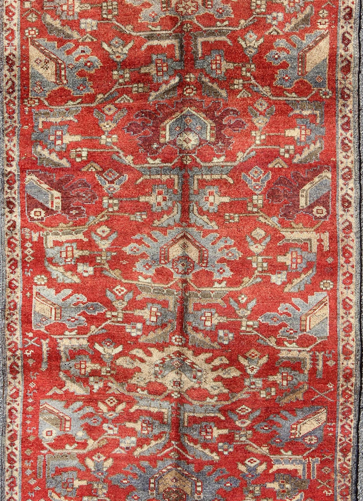 Red Turkish Oushak with Flowing Tribal Design in Red, Blue, and Gray This vintage Oushak rug features an intricate and complex design paired with a unique color combination. Flowing tribal motifs spread across the central field and are surrounde... - Keivan Woven ArtsEN - 140062 - 6027Rug