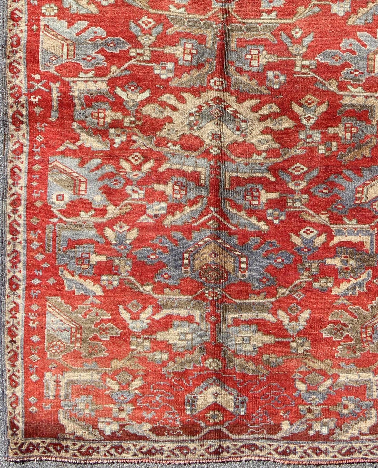 Red Turkish Oushak with Flowing Tribal Design in Red, Blue, and Gray This vintage Oushak rug features an intricate and complex design paired with a unique color combination. Flowing tribal motifs spread across the central field and are surrounde... - Keivan Woven ArtsEN - 140062 - 6027Rug