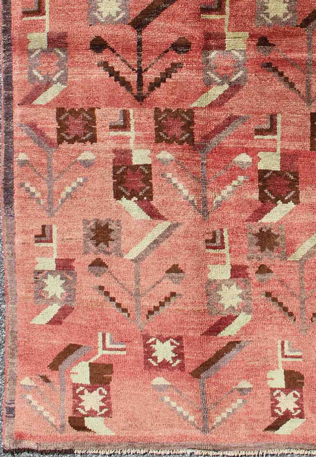 Turkish Oushak Vintage Carpet with Tribal Figures Set soft Red Pink Background Oushak Vintage Carpet with Tribal Figures Set on a Faint Red/Pink Background Keivan Woven Arts/ rug#EN - 140087 origin/Turkey, Hand knotted vintage rug. Measure... - Keivan Woven ArtsEN - 140087 - 5572Rug