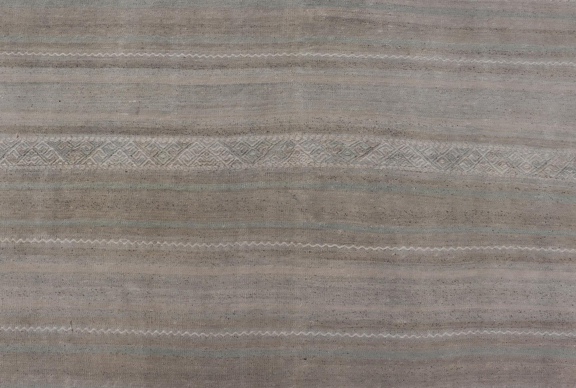 Turkish Flat - Weave Kilim in Muted Colors with Stripes and Embroideries. Country of Origin: Turkey; Type: Kilim; Design: Panel, Stripes, Embroider; Keivan Woven Arts: rug EN - 14009; Gallery Turkish Kilim Vintage Carpet. Measures: 5'5 x 8'6 This c... - Keivan Woven ArtsEN - 14009 - 23941Rug