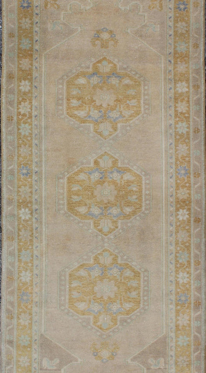 Acid green and gray vintage Turkish Oushak runner with floral medallions, rug en - 140350, country of origin / type: Turkey / Oushak, circa 1940. This vintage Oushak runner features a unique blend of cheerful colors and an intricately beautiful de... - Keivan Woven ArtsEN - 140350 - 5634Rug