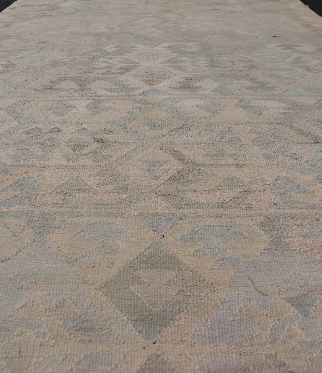 Gallery Turkish Vintage Flat - Weave Tribal Designed Kilim in Earthy Tones This vintage Turkish flat weave Kilim features tribal relics and faded earthy neutrals. The repeating design covers the entire field of muted light blue, caramel, taupe and gr... - Keivan Woven ArtsEN - 14037 - 23738Rug