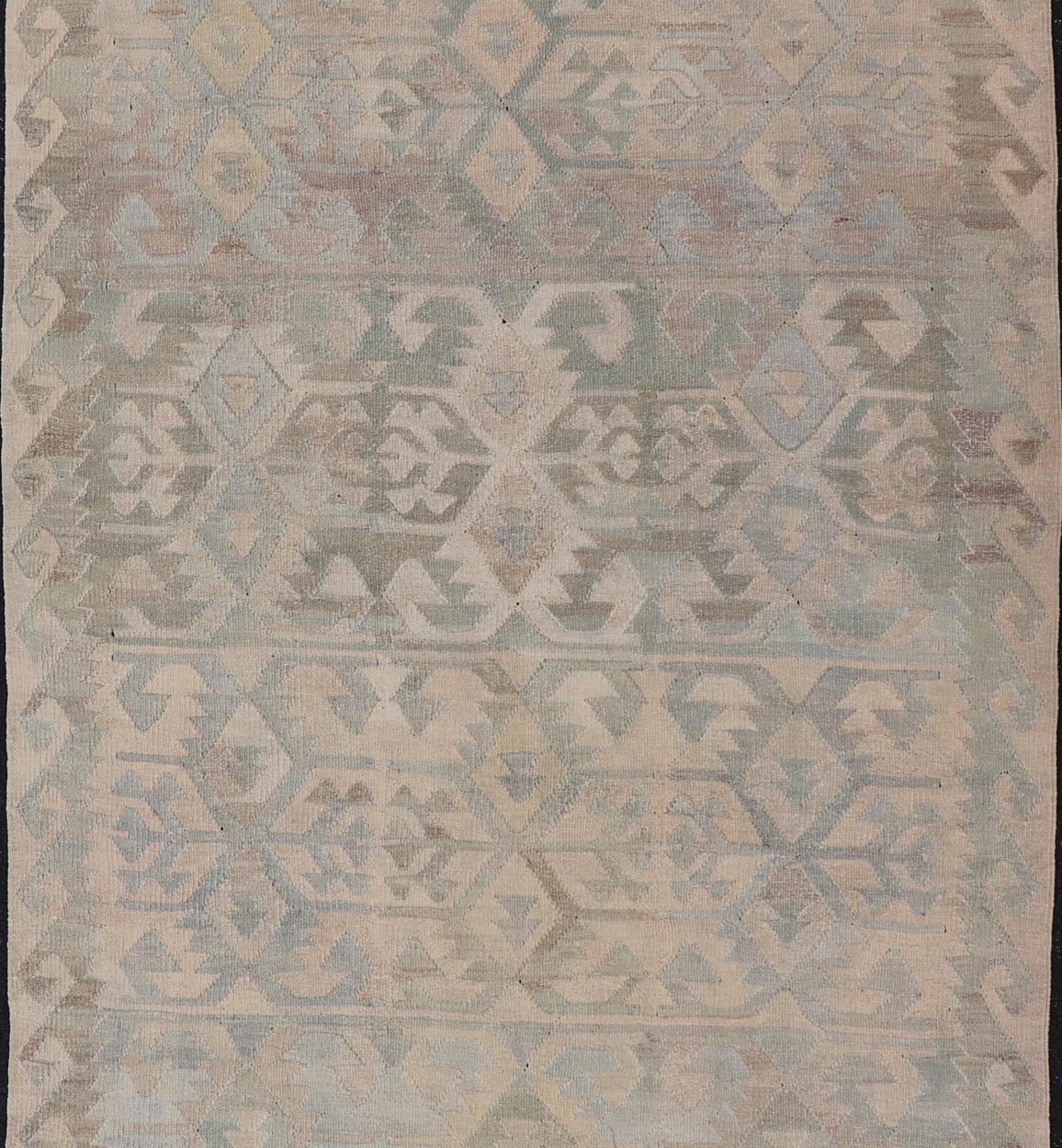 Gallery Turkish Vintage Flat - Weave Tribal Designed Kilim in Earthy Tones This vintage Turkish flat weave Kilim features tribal relics and faded earthy neutrals. The repeating design covers the entire field of muted light blue, caramel, taupe and gr... - Keivan Woven ArtsEN - 14037 - 23738Rug