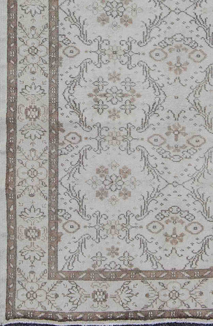 Vintage Turkish Oushak Carpet with Ivory Ground and Repeating Floral Design. Keivan Woven Arts / circa/1940 rug/ EN - 140436 Mid - 20th Century Vintage Oushak. Measures: 5'2 x 8'9. The design of this beautiful vintage Oushak rug from mid - 20th centu... - Keivan Woven ArtsEN - 140436 - 5664Rug