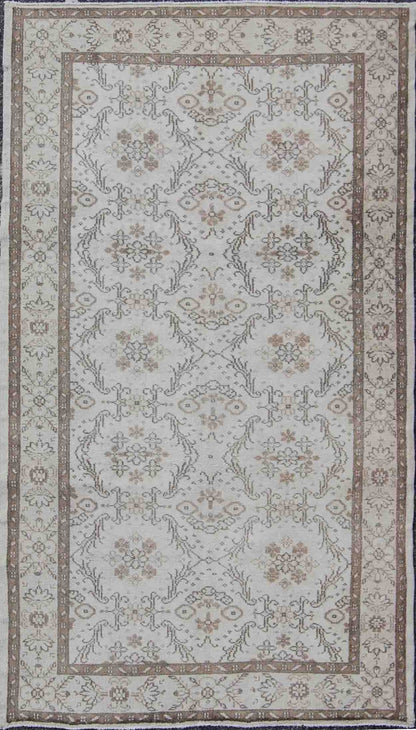 Vintage Turkish Oushak Carpet with Ivory Ground and Repeating Floral Design. Keivan Woven Arts / circa/1940 rug/ EN - 140436 Mid - 20th Century Vintage Oushak. Measures: 5'2 x 8'9. The design of this beautiful vintage Oushak rug from mid - 20th centu... - Keivan Woven ArtsEN - 140436 - 5664Rug
