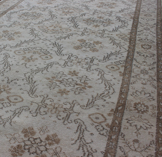 Vintage Turkish Oushak Carpet with Ivory Ground and Repeating Floral Design. Keivan Woven Arts / circa/1940 rug/ EN - 140436 Mid - 20th Century Vintage Oushak. Measures: 5'2 x 8'9. The design of this beautiful vintage Oushak rug from mid - 20th centu... - Keivan Woven ArtsEN - 140436 - 5664