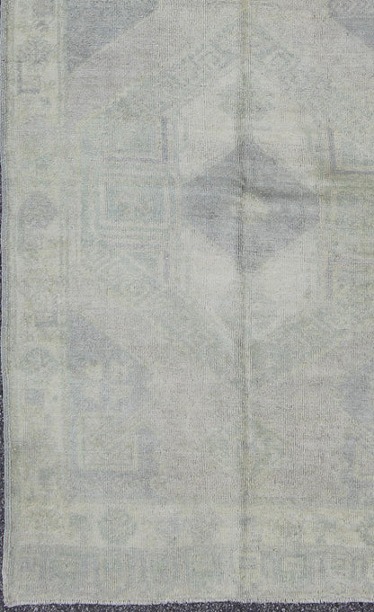 Muted Turkish Oushak Carpet with Two Diamond Medallions in Blue and Gray This Turkish Oushak carpet features a design with two central medallions, as well as patterns of smaller all - over diamonds and scattered sprays of vine scroll and palmettes... - Keivan Woven ArtsEN - 140440 - 6362Rug
