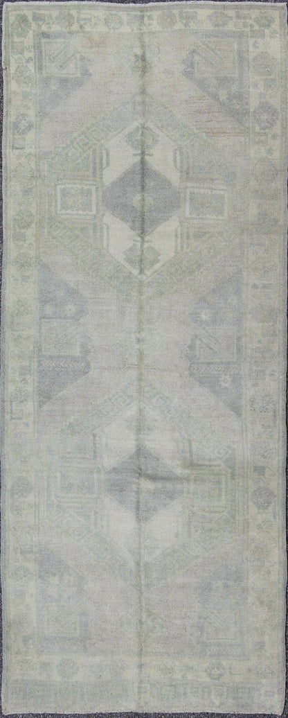 Muted Turkish Oushak Carpet with Two Diamond Medallions in Blue and Gray This Turkish Oushak carpet features a design with two central medallions, as well as patterns of smaller all - over diamonds and scattered sprays of vine scroll and palmettes... - Keivan Woven ArtsEN - 140440 - 6362Rug