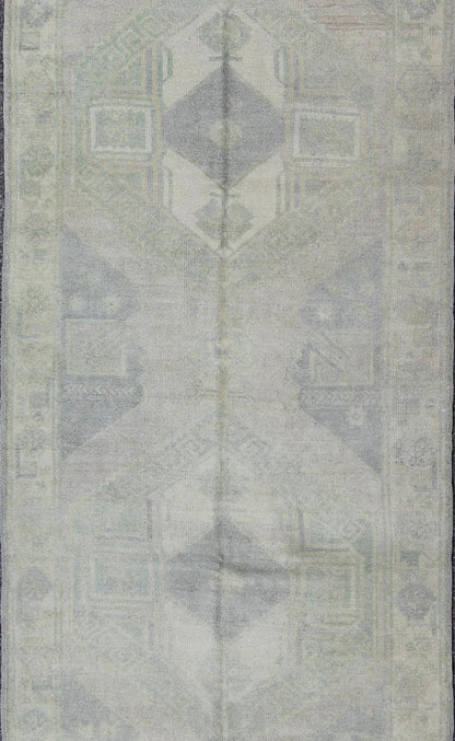 Muted Turkish Oushak Carpet with Two Diamond Medallions in Blue and Gray This Turkish Oushak carpet features a design with two central medallions, as well as patterns of smaller all - over diamonds and scattered sprays of vine scroll and palmettes... - Keivan Woven ArtsEN - 140440 - 6362Rug
