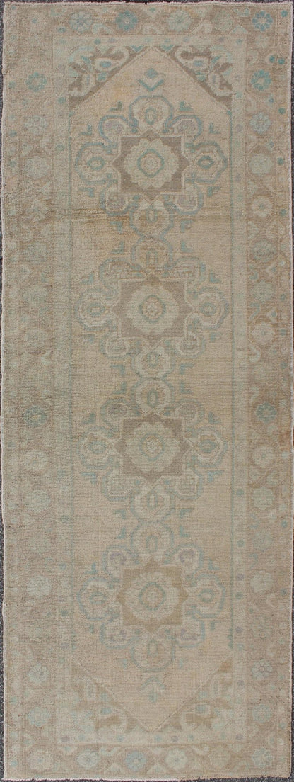 Floral medallion vintage Turkish Oushak runner with faded color palette, rug en - 140461, country of origin / type: Turkey / Oushak, circa 1930 This vintage Turkish Oushak gallery rug (1930) features a unique blend of colors and an intricately bea... - Keivan Woven ArtsEN - 140461 - 6049Rug
