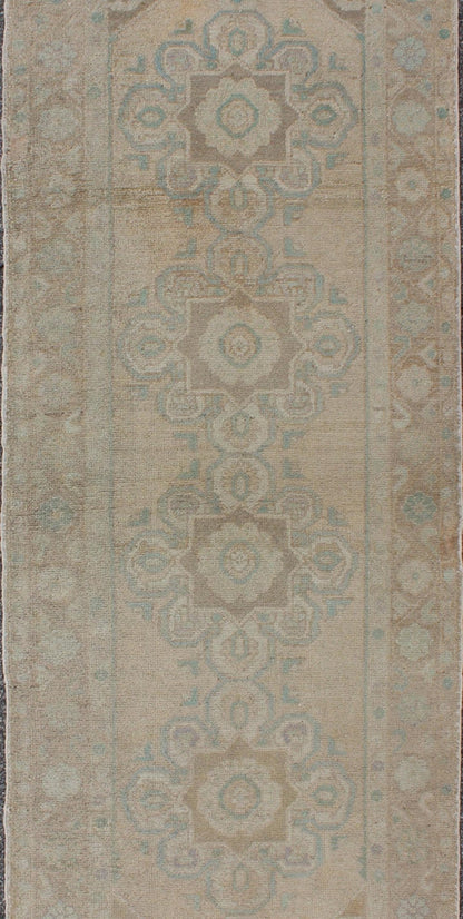 Floral medallion vintage Turkish Oushak runner with faded color palette, rug en - 140461, country of origin / type: Turkey / Oushak, circa 1930 This vintage Turkish Oushak gallery rug (1930) features a unique blend of colors and an intricately bea... - Keivan Woven ArtsEN - 140461 - 6049Rug