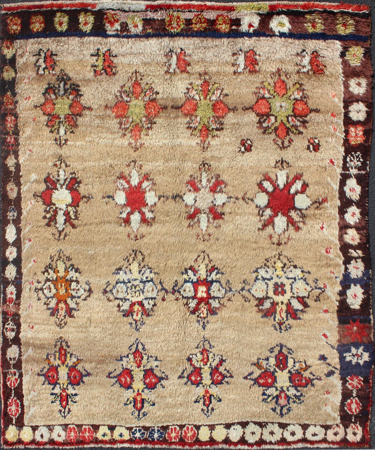 Angora Turkish Tulu Carpet with Colorful Floral Designs Set on Sand Field Angora Turkish Tulu Carpet Antique rug//en - 140522 origin/turkey kwarugs his Tulu carpet features several multicolored floral motifs laid across a sand - colored field... - Keivan Woven ArtsEN - 140522 - 6370Rug